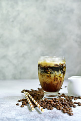 Homemade delicious iced coffee or frappe in a tall glass.