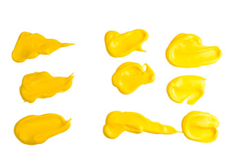 Yellow sauce splashes isolated on white background.