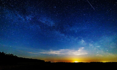 Moon rise against the starry sky.