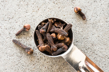 Whole Cloves Spilled from a Teaspoon