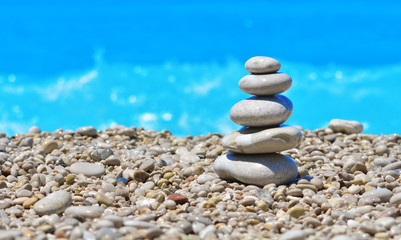 Zen stones on a beach pebble. Sea pebbles tower. Harmony and stability concept.