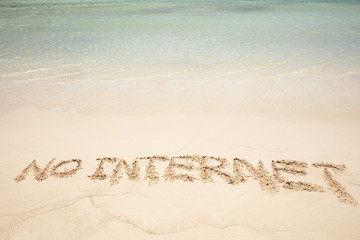 No Internet Text Written On Sandy Beach