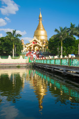 View of the Buddhist temple of the Maha Wizaya Pagoda on a sunny day. Yangon, Myanmar (Burma)