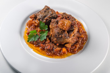 Dish with portion of oxtail stewed