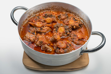 Isolated pan with oxtail stewed vaccinara
