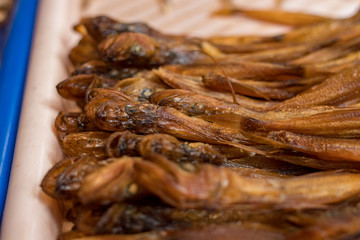 Baikal fish hot smoked and dried on the street market. Listvyanka, Siberia, Russia