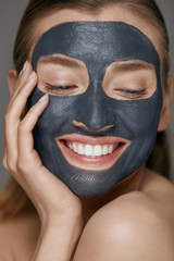 Beauty face skin care. Woman with cosmetic spa facial mask