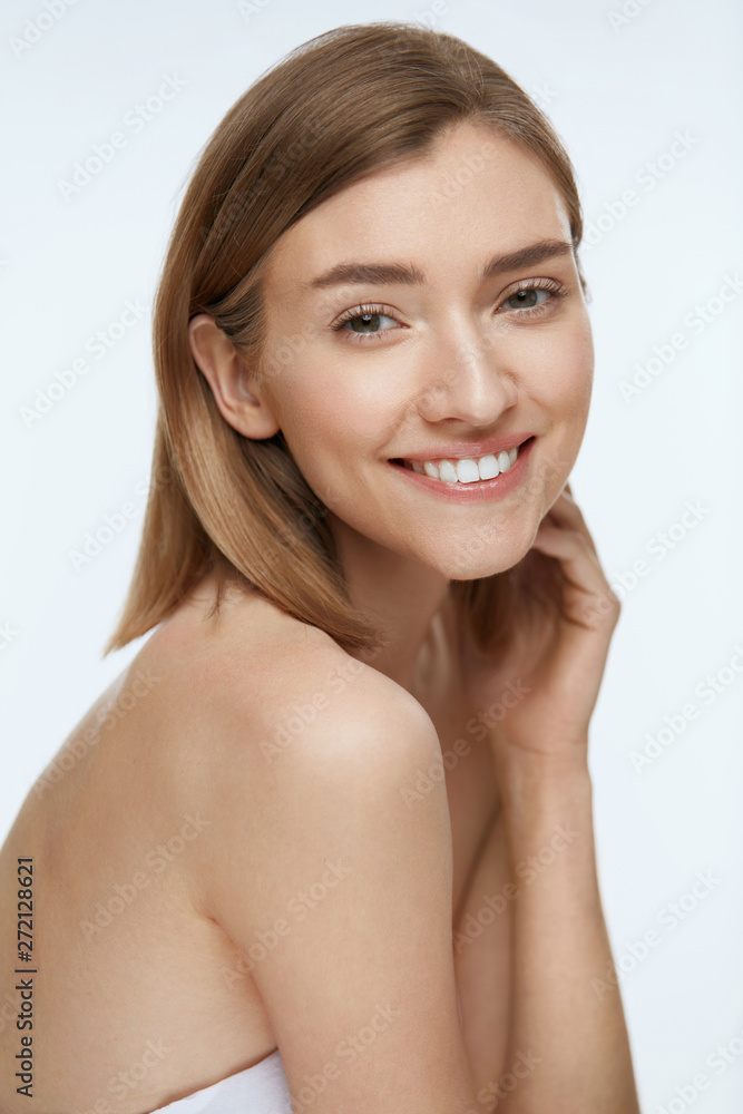 Wall mural Beauty. Woman model with fresh skin and white smile portrait