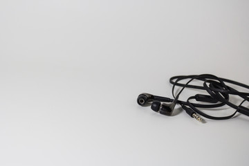 Naklejka premium Black headphones close-up On the white background scene