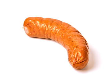 Grilled sausages with onions on a Board on a light background. Juicy sausage rings in a pile on a white background.