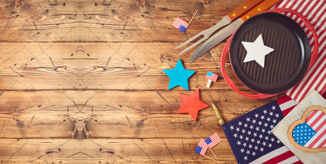 Happy Independence Day, 4th of July celebration concept with USA flag and barbeque grill  on wooden...