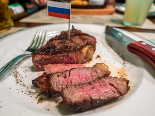 Beef steak on white dish