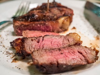 Beef steak on white dish