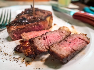 Beef steak on white dish