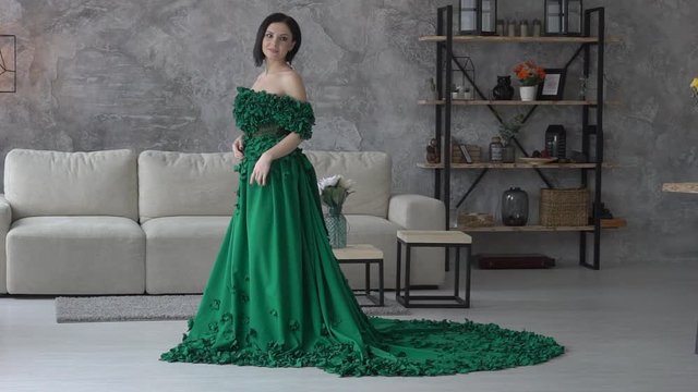 Cinemagraph Beautiful Brunette Woman Standing In Long Dress On The Background Of