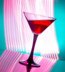 red wine in a glass on a colored background