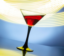 red wine in a glass on a colored background