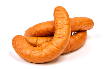Meat sausages with glitter on a light background. Three boiled pork sausages. Junk food.