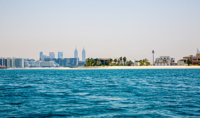 Naklejka premium Dubai Marina skyscrapers and villas on the Palm Jumeirah. Luxury properties of UAE