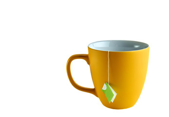 Yellow cup with tea pack on white background