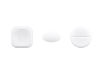 Set of white pills with different shapes. Isolated