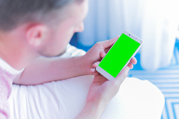 man looking for smarthphone