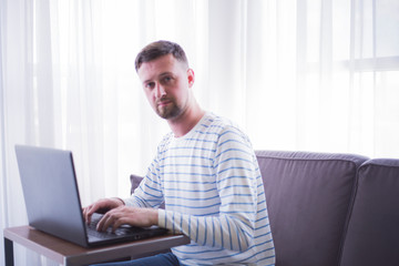man working on his laptop at home