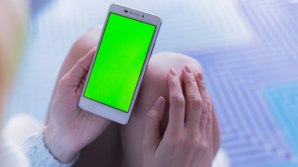 girl with mobile phone in the room