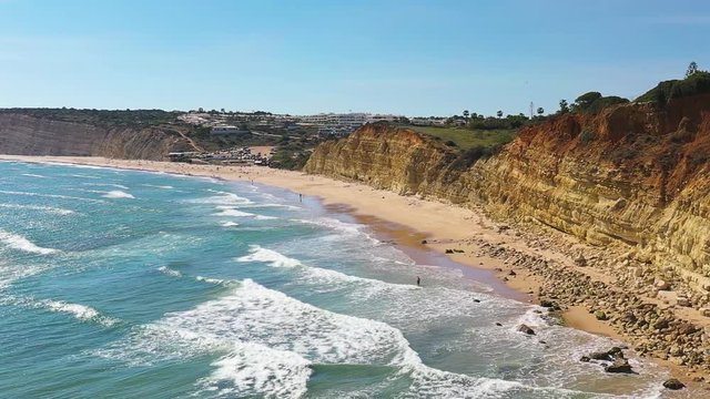 Slow Motion Flight Over Atlantic Ocean Waves at Do Camilo beach, Lagos, Algerve, Portugal