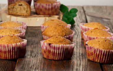 Vanilla cupcake, homemade pastry on wooden background