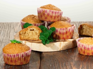 Vanilla cupcake, homemade pastry on wooden background