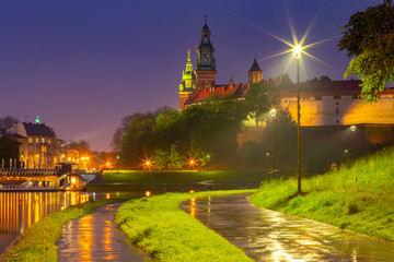 Krakow. The facade of the famous Wawel Castle in night lighting.