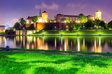 Krakow. The facade of the famous Wawel Castle in night lighting.