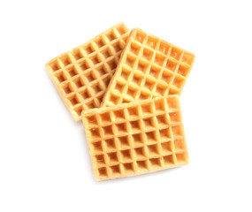 Delicious waffles for breakfast on white background, top view