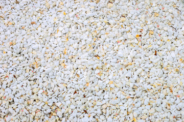 White pebble stone texture on the ground. -