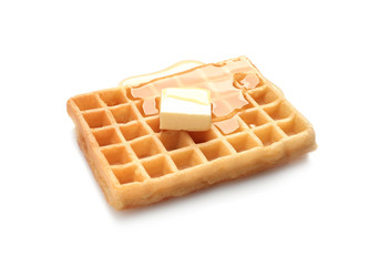 Delicious waffle with butter and honey on white background
