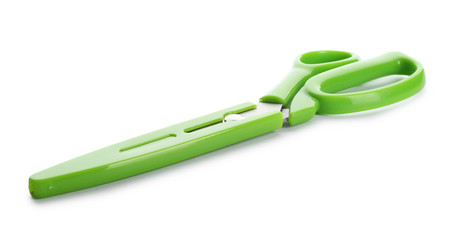 Scissors in plastic blade cover on white background