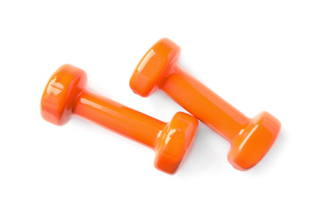 Color dumbbells on white background. Home fitness, top view