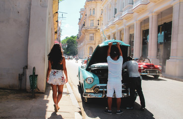 Colorful street and old car in Havana, Cuba