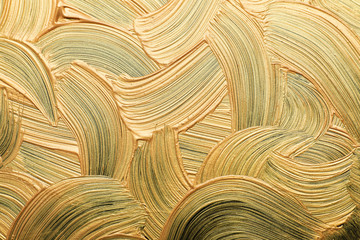 Fototapeta premium Golden paint brush strokes as background, closeup