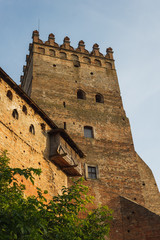 The medieval castle is illuminated by the sunset. Lutsk High Castle, also known as Lubart's Castle	