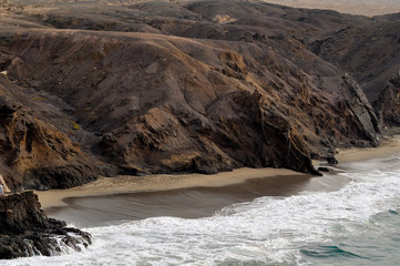 Beautiful wild beach on rocky coast of the Atlantic Ocean. La Pared, Fuerteventura Canary Islands, Spain