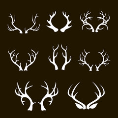 White silhouettes of deer antler branched and acute, vector set