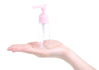 Bottle with dispenser empty in hand on white background isolation