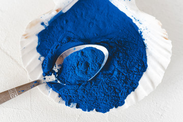 Blue Spirulina algae powder, healthy dietary supplement.