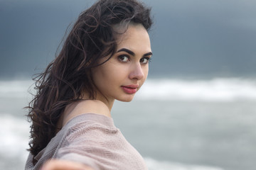 Young Woman at the Sea Coast Beach