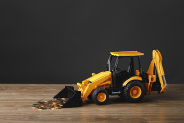 backhoe tractor rake up money coins