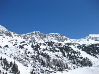 snowy alps in the swiss mountains on a beautiful sunny winter day