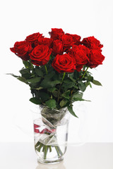 red roses bouquet on white background, fifteen flowers