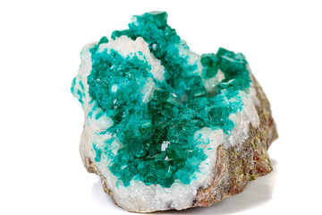 Macro mineral stone Dioptase silicate copper on a white background